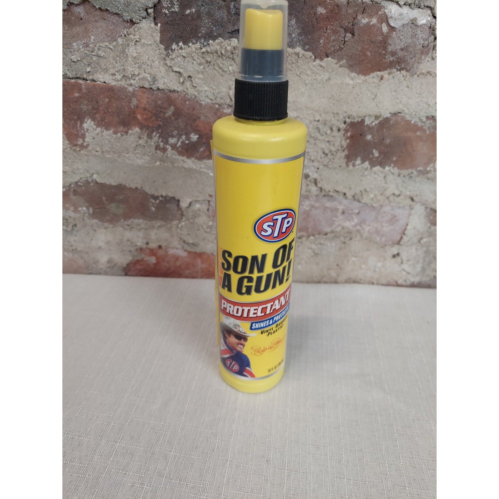 STP Son Of A Gun Protectant Spray Shines Protects Vinyl Rubber Plastic 10 FL OZ